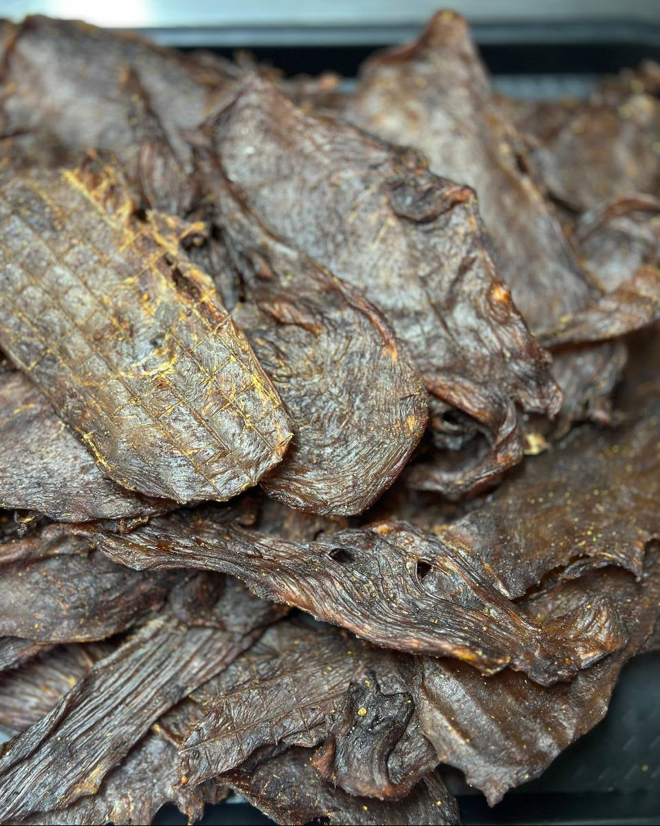 Close-up of dried leafy vegetables on a dark surface